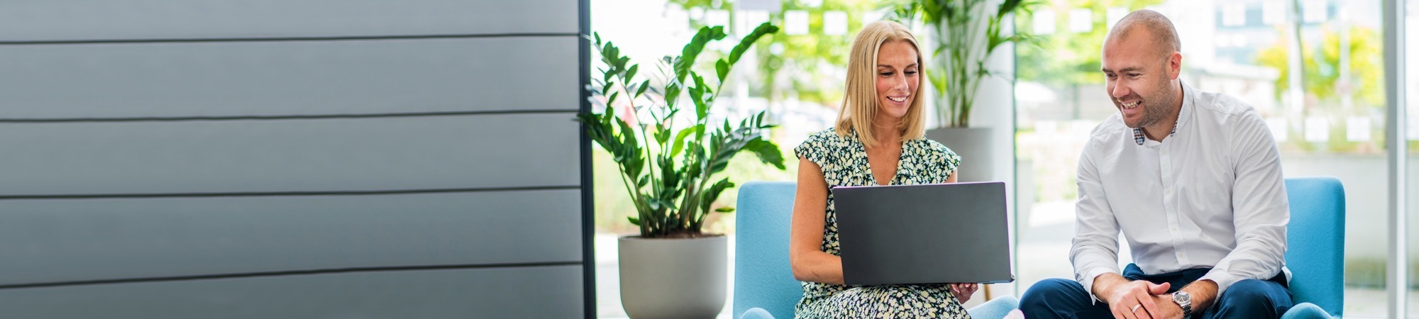 happy people in a meeting with laptop